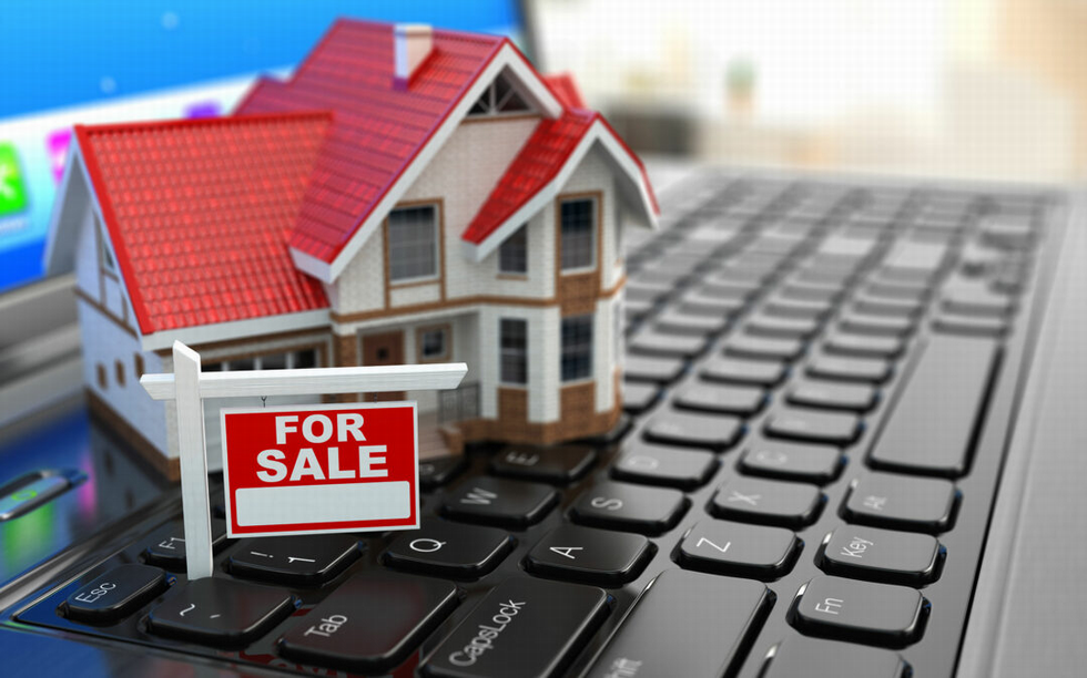 Communication Solutions for Real Estate Professionals Model house with for sale sign on computer keyboard
